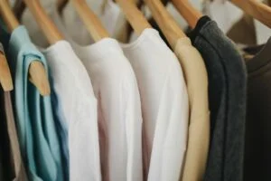 White Long Sleeves Shirts on Brown Wooden Clothes Hanger