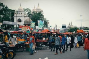 Crowded Street with Market Stalls