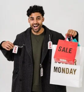 Man Feeling Happy With His Gray Coat On Sale